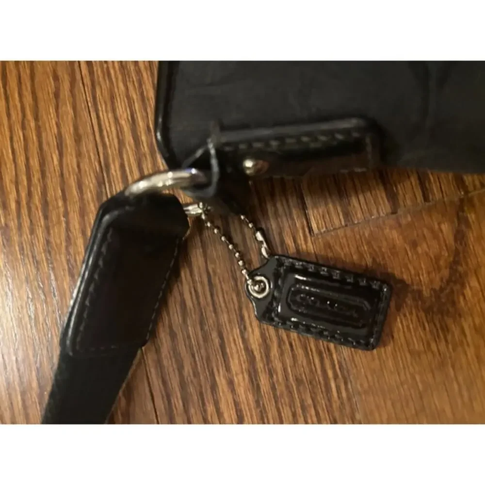 Coach crossbody handbag purse adjustable strap black jacquard logo spellout